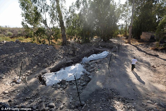 The site is not far from the Jordan River, a few hundred metres from Lake Tiberias. This image shows a man walking next to the site on Sunday